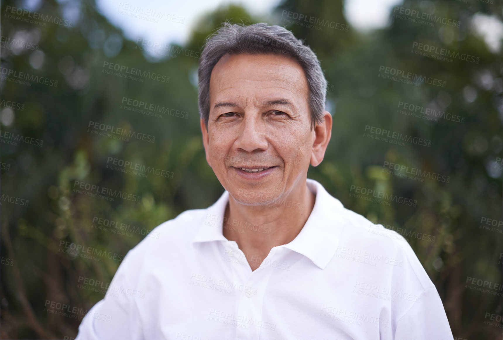 Buy stock photo Cropped shot of a handsome mature man standing outdoors