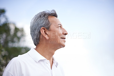 Buy stock photo Mature man, smile and thinking in outdoors, relax and daydreaming in countryside or park. Happy male person, profile and fresh air for mindfulness on holiday or vacation, peace and travel in nature