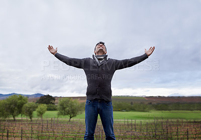 Buy stock photo Man, travel and countryside for freedom with arms stretching  for deep breath, fresh air and wellness. Male person, nature and happy on vacation, trip and living for adventure in France for journey