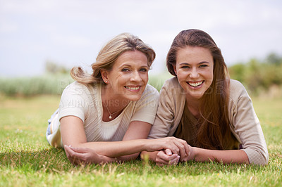 Buy stock photo Women, mother and daughter with holding hands, grass and mature person with connection, care and love. Mom, girl and family with bonding, reunion and vacation with lawn, happy and together in spring