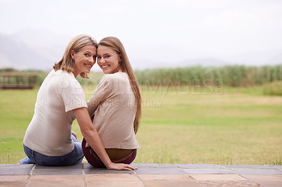 Buy stock photo Women, mother and daughter in garden, portrait and together with smile, care and love on spring vacation in nature. Mom, girl and family with connection, bonding and love on patio at countryside home
