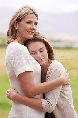 Buy stock photo A mother embracing her daughter