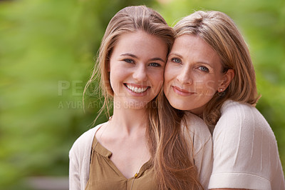 Buy stock photo Portrait of a mother embracing her daughter