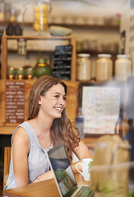 Buy stock photo Shot of a two young woman talking in a cafe