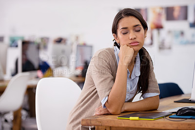 Buy stock photo Woman, tired and sleep at desk for overworked as search editor for production company, stressed and working. Female person, computer and bored at job, fatigue and depressed with bad mental health