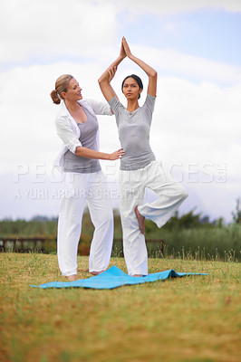 Buy stock photo Woman, personal trainer and yoga on field in nature for spiritual wellness, namaste or wellbeing. Young female person, yogi or fitness teacher in zen, balance or stretching on mat in outdoor exercise