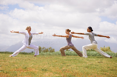 Buy stock photo Group, women and yoga instructor in warrior pose outdoor for healthy body, exercise or fitness. Teacher, virabhadrasana and people in nature for balance, stretching and holistic practice for wellness