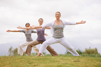 Buy stock photo Group, yoga and women in warrior pose outdoor for healthy body, exercise and fitness. Park, virabhadrasana and people in nature for balance, stretching and friends practice together for wellness
