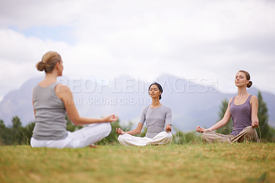 Buy stock photo Lotus, instructor and meditation outdoor for yoga, healthy body and mindfulness exercise to relax. Peace, group and calm women in padmasana in nature for balance, spirituality or breathing together