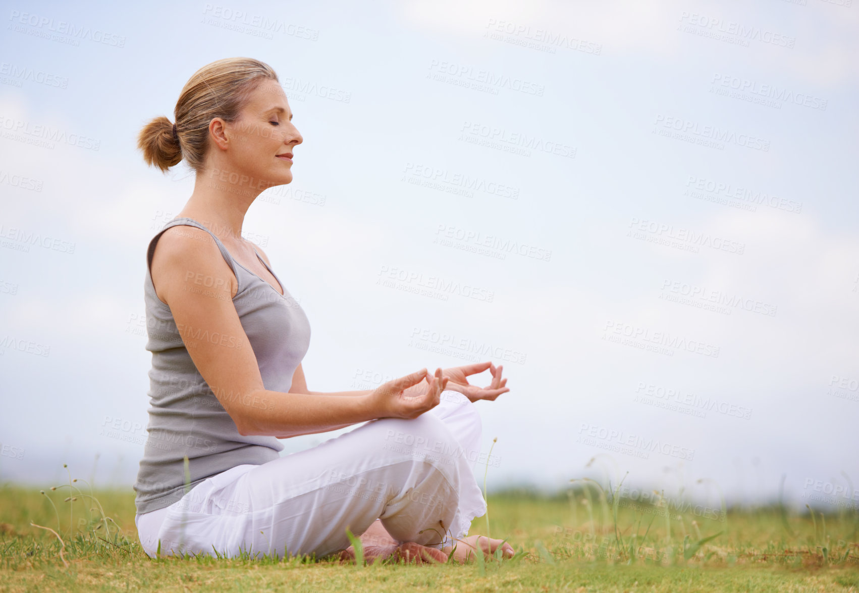 Buy stock photo A woman doing yoga out