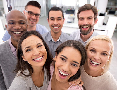 Buy stock photo High angle shot of a group of positive businesspeople
