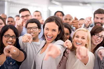 Buy stock photo Shot of a group of smiling businesspeople pointing at the camera