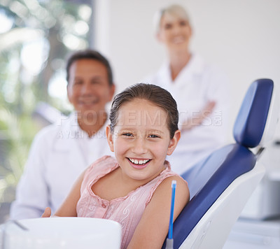 Buy stock photo Portrait, dentist and man with kid in clinic for expert advice, confidence and orthodontics in medical health. Dental medicine, healthcare and professional with girl patient, smile and oral service