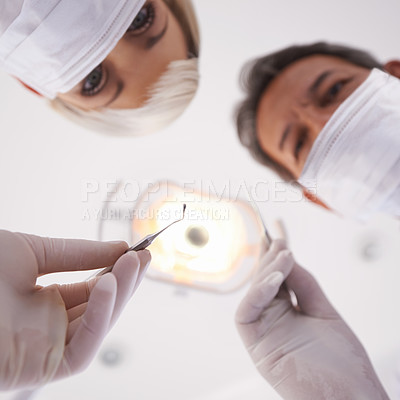 Buy stock photo Portrait of a dentist and his assistant during a routine checkup