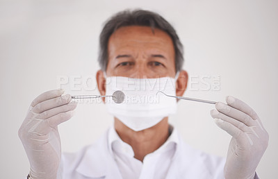Buy stock photo Portrait, dentist and man with tools, mask and expert advice for orthodontics in medical health. Dental medicine, healthcare and professional with pride, steel equipment and ppe for oral service.