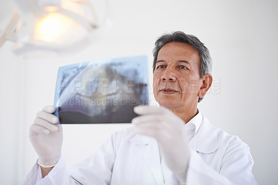 Buy stock photo Mature dentist, man and xray of teeth for dental surgery, healthcare and oral health with treatment at clinic. Medical professional with analysis of scan, review and orthodontics with mouth care