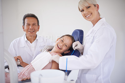 Buy stock photo Portrait, dentist and technician with child in clinic for expert advice, orthodontics and medical health. Dental medicine, healthcare and professional man with girl, woman and oral service in office