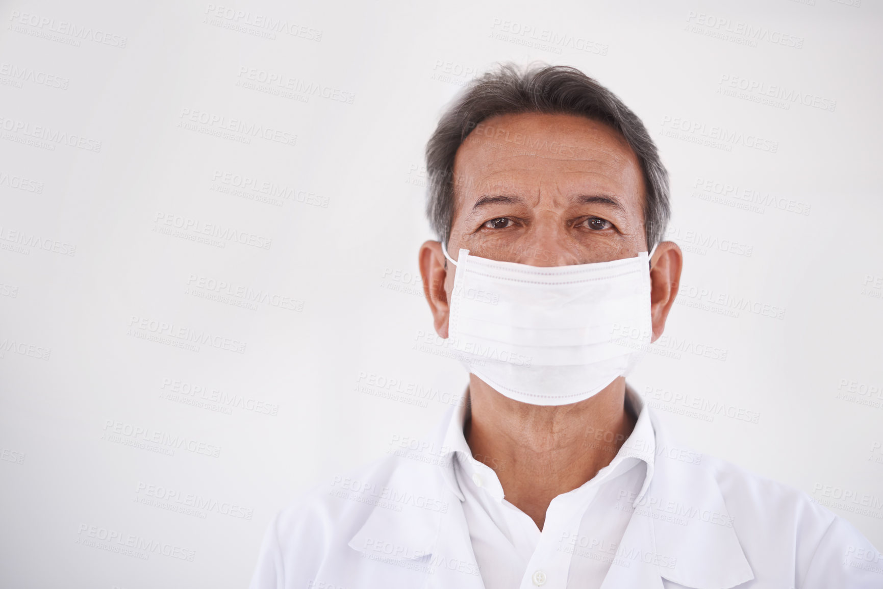 Buy stock photo Portrait, dentist and doctor in clinic with mask, mockup and expert advice in orthodontics for medical health. Dental medicine, healthcare and professional with pride, ppe and oral service with space