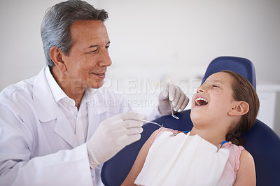 Buy stock photo Girl, child and dentist with tools for healthcare, gum disease and oral hygiene with mouth inspection. Medical, orthodontics and consultation for teeth health, cleaning and wellness with excavator