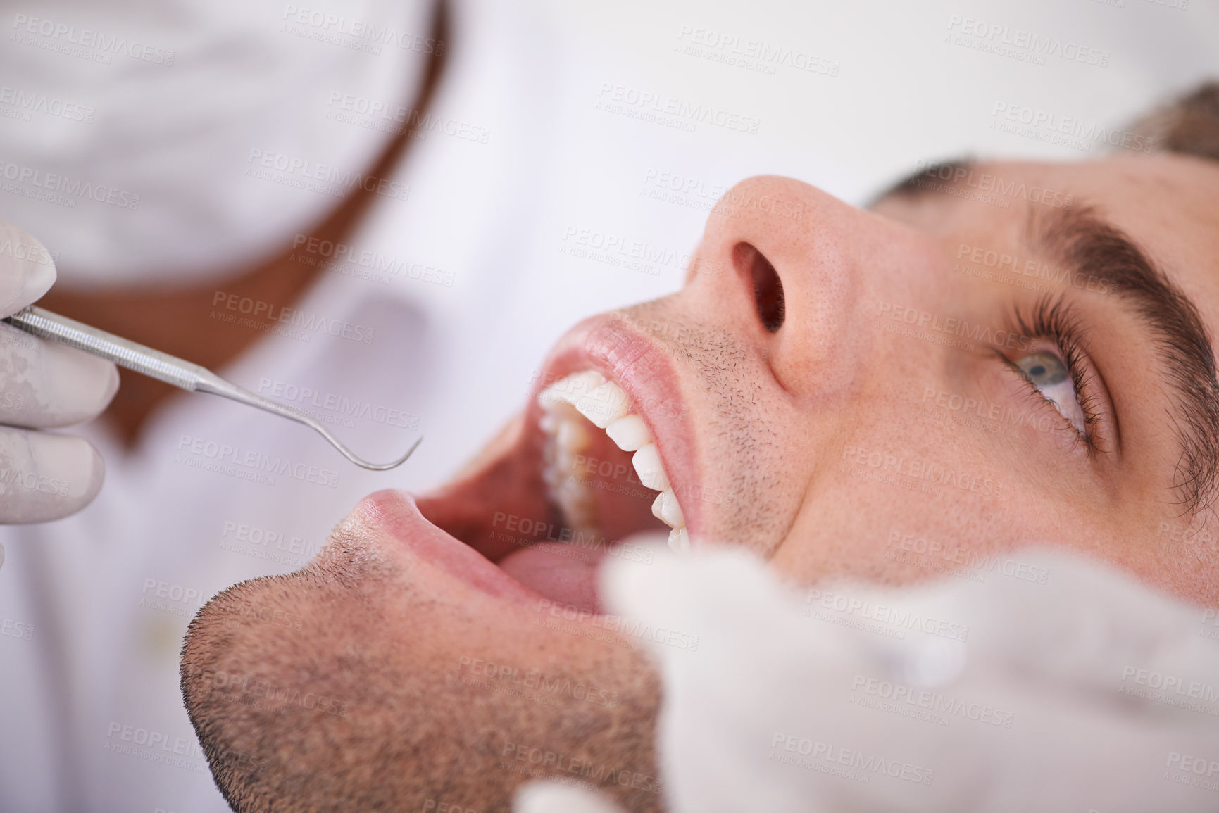 Buy stock photo Cropped shot of a young man at the dentist