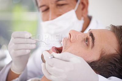 Buy stock photo Dental, man and dentist with tools for healthcare, gum disease and oral hygiene with mouth inspection. Medical, orthodontics and consultation for teeth health, cleaning and wellness with excavator