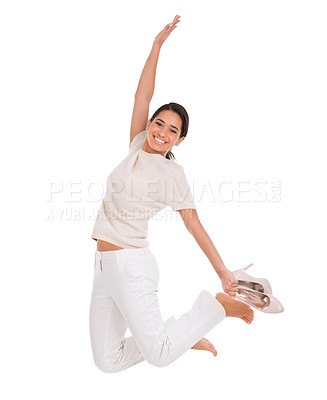 Buy stock photo Woman, excited and jump in studio for success, winning and achievement with fashion, bonus or sale. Excited portrait of winner for freedom, yes or celebration in air with heels on a white background
