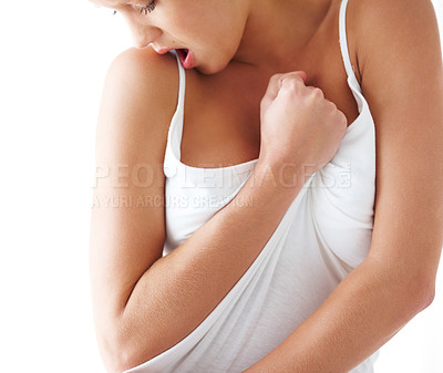Buy stock photo Emotion, feeling and grabbing clothes with woman in studio isolated on white background for release. Hands, sexy and sensual with young feminine person closeup for desire, passion or satisfaction