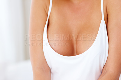 Buy stock photo Cropped shot of a young woman's cleavage
