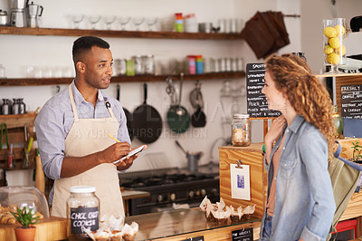 Buy stock photo Woman, cafe and barista with order at counter for purchase, shopping and lunch at coffee shop. Female person, small business and waiter with notepad for discussion, writing and customer service