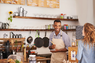 Buy stock photo Barista, counter and woman with order at cafe with smile, notes and service for good customer experience. Waiter, writing and lady with choice, decision or pick from menu in restaurant, deli or diner