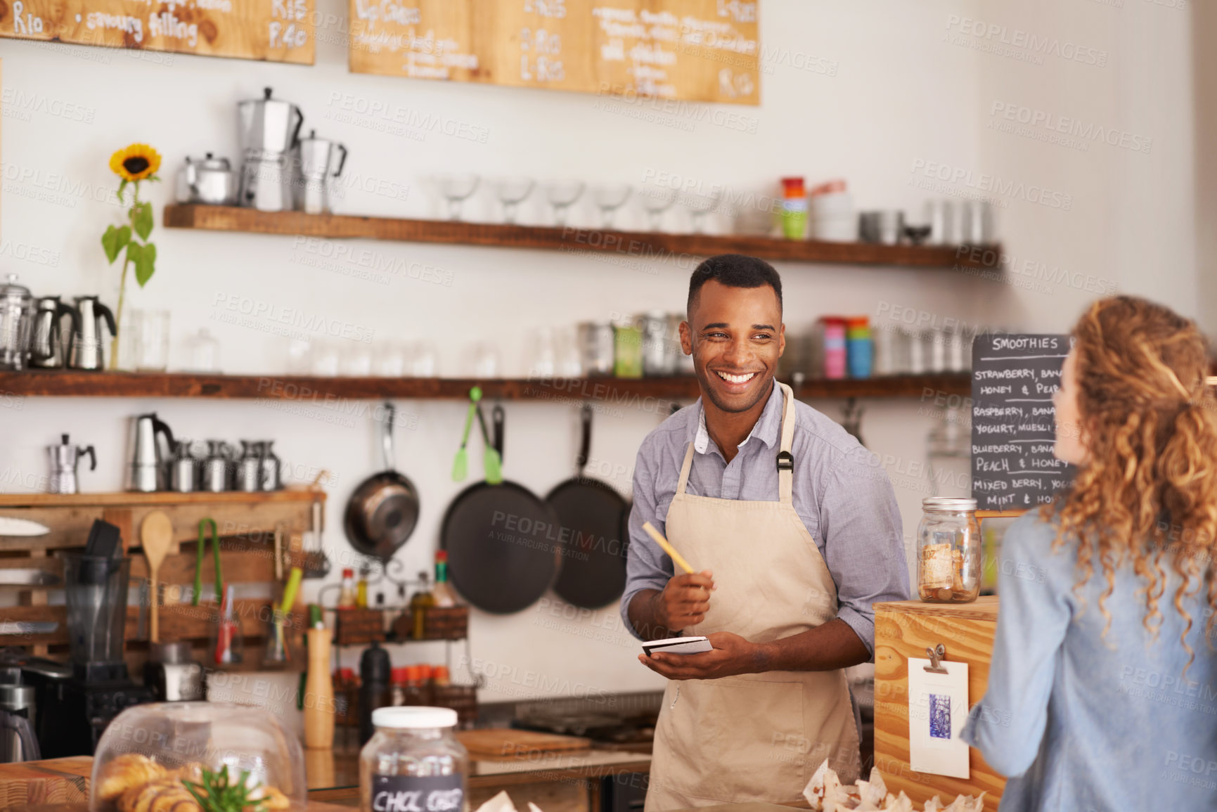 Buy stock photo Barista, counter and woman with order at cafe with smile, notes and service for good customer experience. Waiter, writing and lady with choice, decision or pick from menu in restaurant, deli or diner