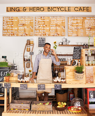 Buy stock photo Portrait, smile and phone call with black man in cafe for communication, networking or service. Coffee shop, restaurant and small business with happy young store owner or vendor working in bakery