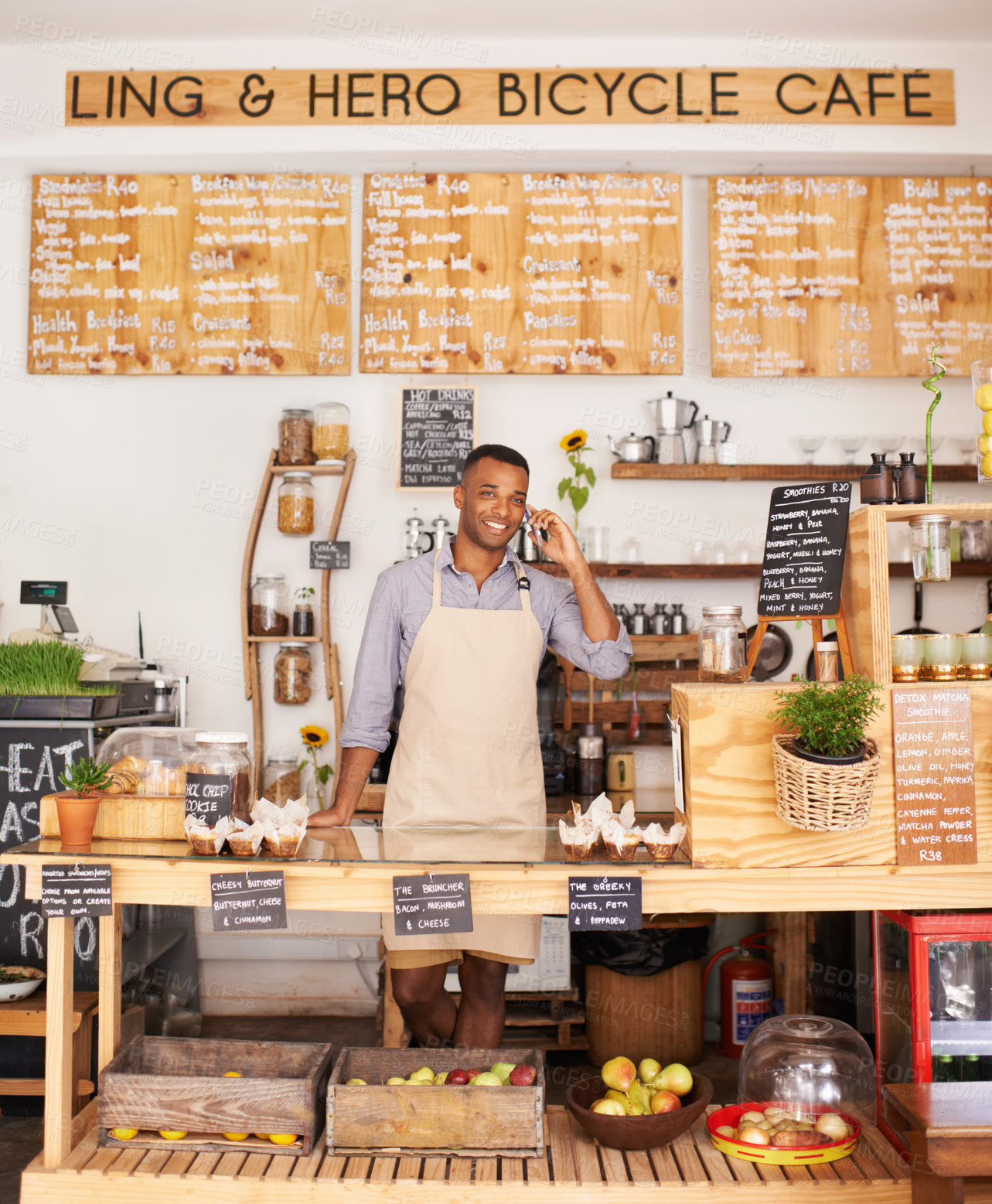 Buy stock photo Portrait, smile and phone call with black man in cafe for communication, networking or service. Coffee shop, restaurant and small business with happy young store owner or vendor working in bakery