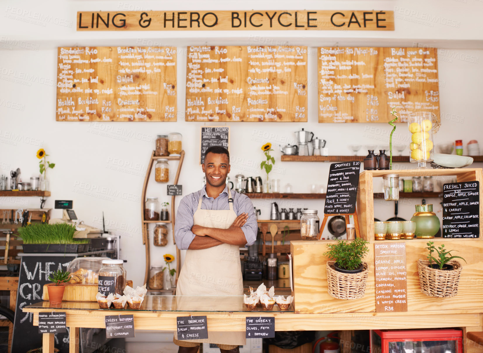 Buy stock photo Portrait, black man and barista with arms crossed in cafe with pride for career or job. Waiter, smile and confidence of African person from Nigeria in restaurant, small business and coffee shop.