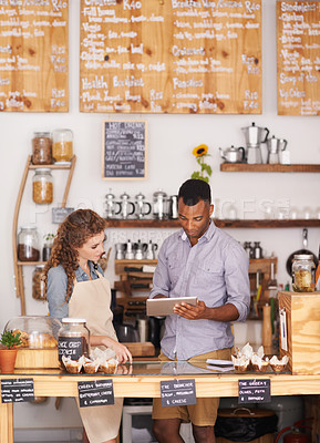 Buy stock photo Small business, talking and employees with a tablet, digital planning or share ideas for profit growth. Black man, woman or coworkers with technology, store or happiness with communication at a store