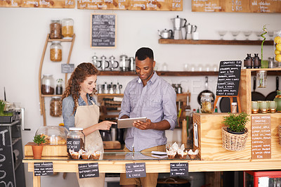 Buy stock photo Business, man and woman with a tablet, cafe and explain process with planning, schedule and talking. Partnership, entrepreneur and employees with technology, profit growth and conversation in a store