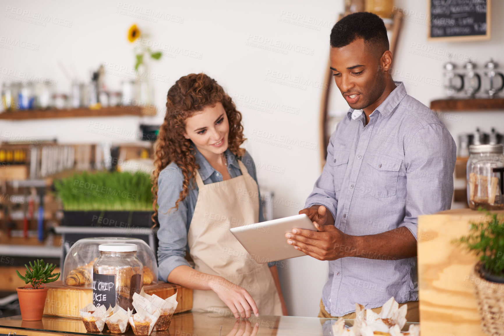 Buy stock photo Tablet, cafe owner and teamwork of people talking, discussion and manage orders. Waiters, black man and woman in restaurant with technology for inventory, stock check and managing sales in store.