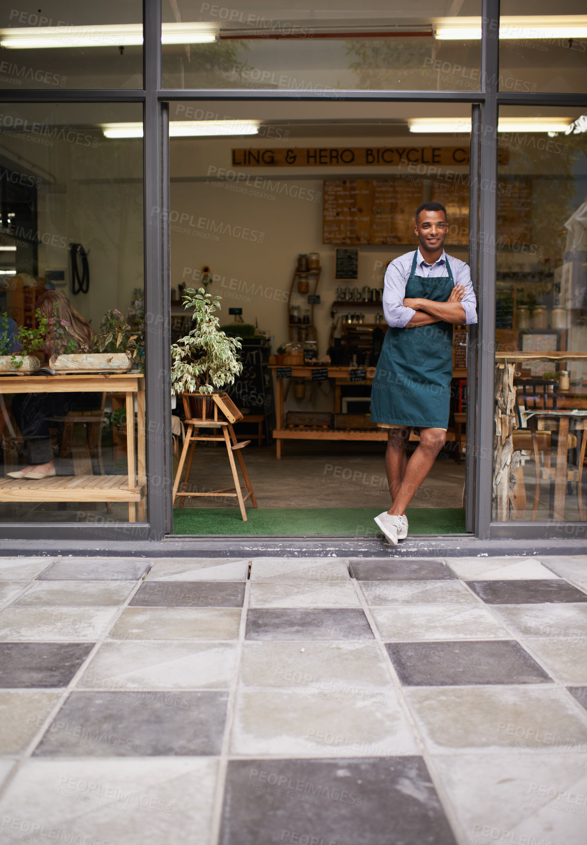 Buy stock photo Welcome portrait, coffee shop and man as small business owner at front door with a smile. Entrepreneur person as barista, manager or waiter in restaurant for service, career pride and startup goals