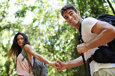 Buy stock photo Hiking, holding hands and portrait of couple in nature for adventure, freedom and walking with backpack outdoors. Forest, travel and man and woman for holiday, vacation and trekking for wellness