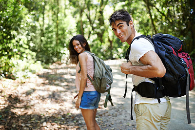 Buy stock photo Hiking, walking and portrait of couple in nature for adventure, fitness and explore with backpack outdoors. Forest, travel and man and woman on trail for holiday, vacation and trekking for wellness