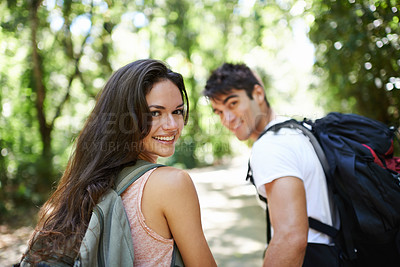 Buy stock photo Walking, forest or portrait of happy couple in nature or wilderness on a trekking adventure. Man, woman or back of people hiking in natural park or woods for exercise or wellness on holiday vacation 