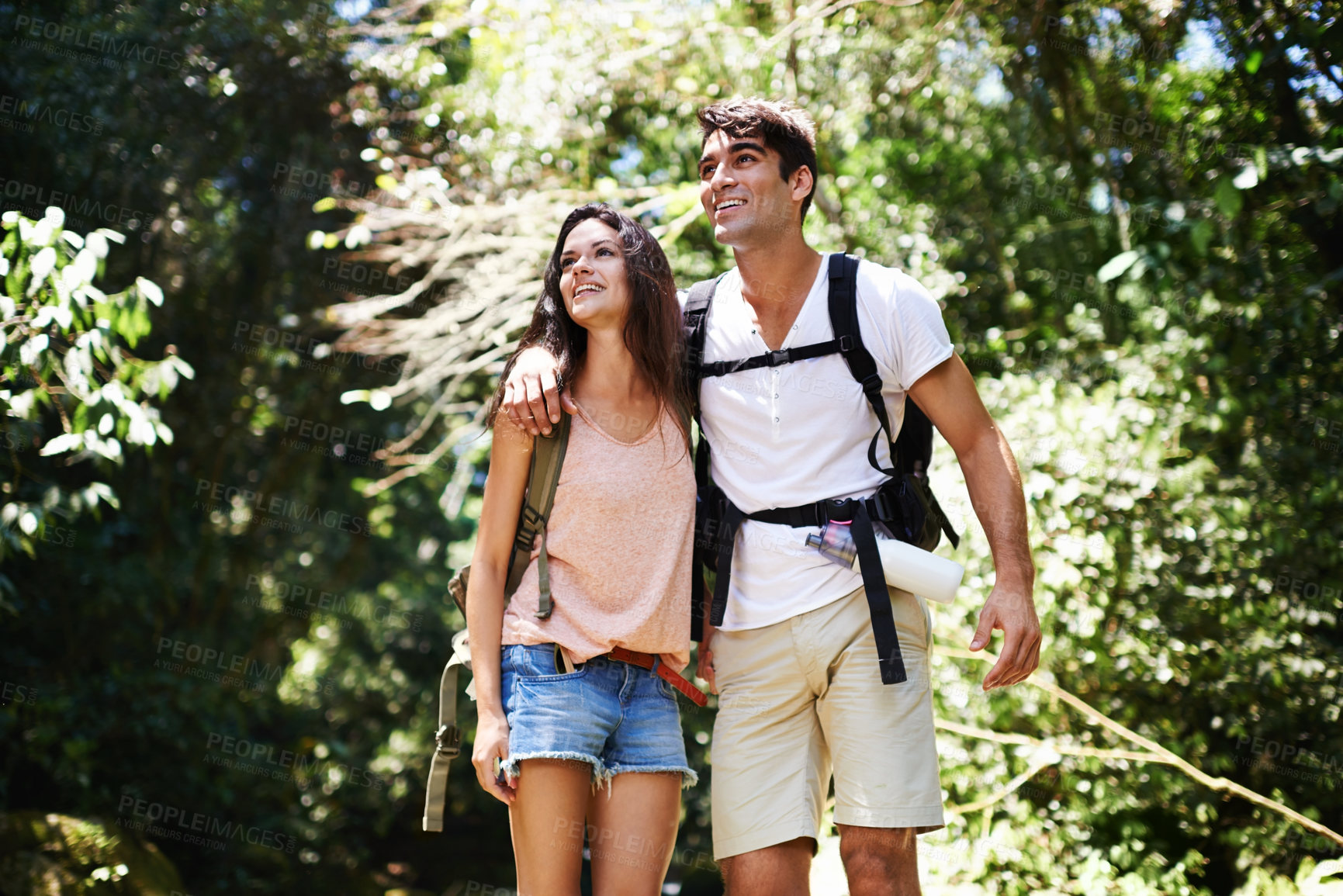 Buy stock photo Hiking, happy and couple in nature walking for adventure, freedom and explore together outdoors. Dating, travel and man and woman on mountain for holiday, vacation and trekking for wellness in forest