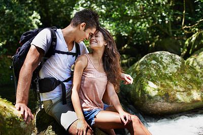 Buy stock photo Romantic, nature and couple by river for hiking, trekking and adventure for wellness, relax and explore. Dating, love and happy man and woman on holiday, vacation and travel on weekend for bonding
