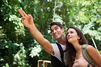 Buy stock photo Hiking, park or happy couple pointing in nature, forest or outdoor trekking adventure on holiday. Man, woman or romantic people in woods for travel or journey for care, love or wellness on vacation