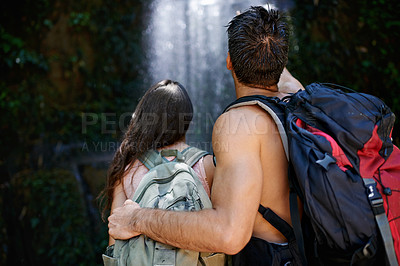 Buy stock photo Hiking, waterfall or back of couple in nature for journey on outdoor trekking adventure together. Love, hug or people on holiday vacation to relax in park for fitness exercise, travel or wellness