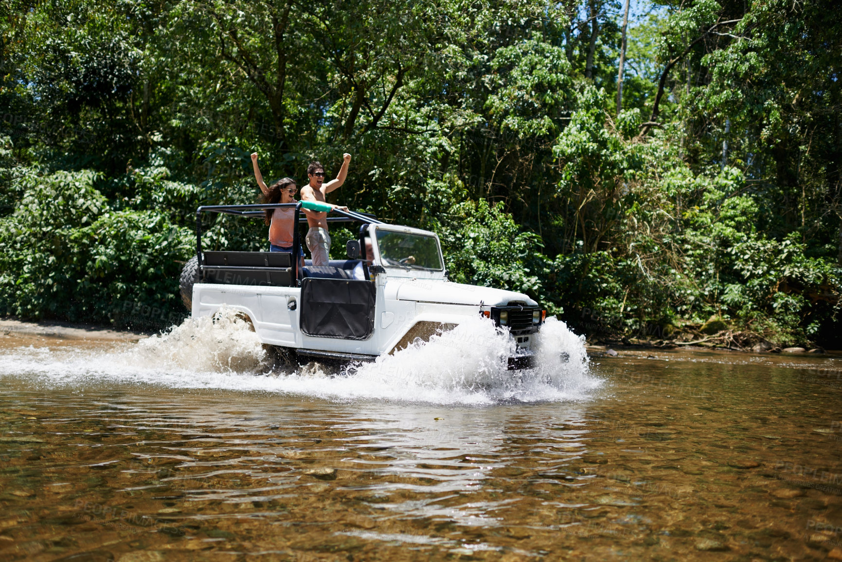 Buy stock photo Couple, forest and adventure with 4x4, river and outdoor with love, care or nature with drive in summer. People, man and woman for splash in vehicle, car or journey on road trip in jungle in Colombia