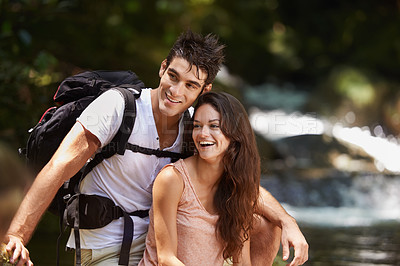 Buy stock photo Happy, nature and couple by river for hiking, trekking and adventure for wellness, relax and explore forest. Dating, love and man and woman on holiday, vacation and freedom on weekend for exercise