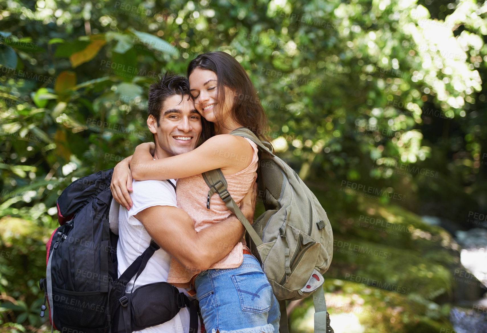 Buy stock photo Hiking, forest or portrait of happy couple hug in nature or wilderness on a trekking adventure. Man, woman or romantic people in natural park or woods with care love or wellness on holiday vacation