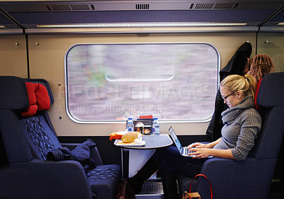Buy stock photo Cropped shot of an attractive young woman traveling by train