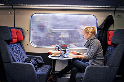 Buy stock photo Cropped shot of an attractive young woman traveling by train